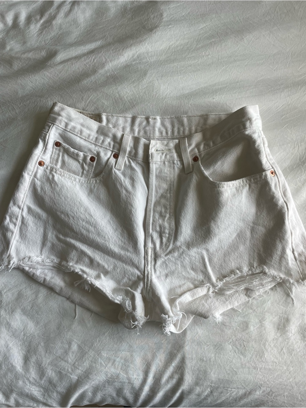 Levi's White Denim Cutoff Shorts with Frayed Hem